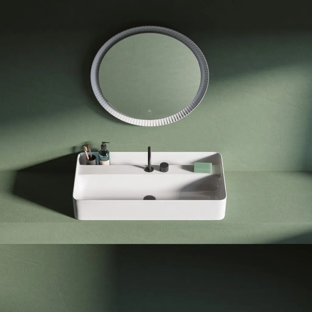 Mobile lavabo Brooklyn di The.Artceram in verde salvia matt con lavabo rettangolare bianco opaco e ripiano integrato. Courtesy The.Artceram